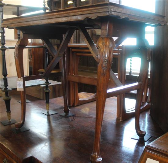 Continental carved walnut folding tray table(-)